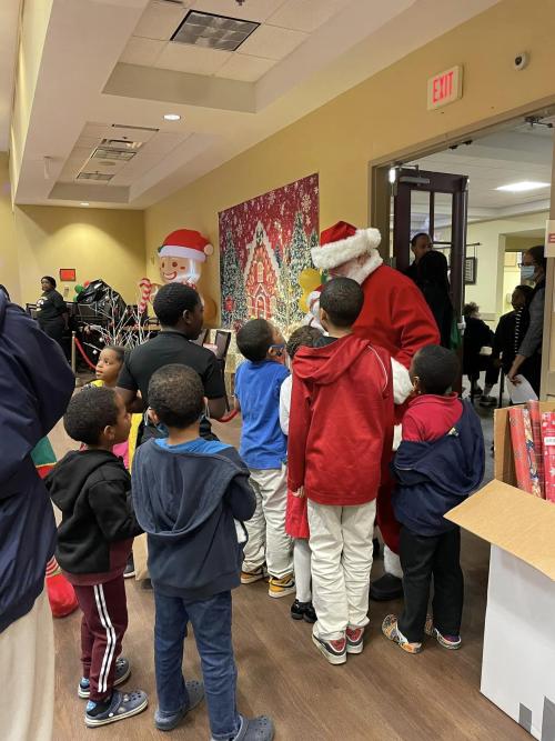 Giving Side of Christmas children around Santa 320662826_1194214804849617_7266497716436835377_n.jpg
